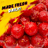 Close-up of chamoy cherry sours candy coated in tangy, savory chamoy seasoning – made fresh daily